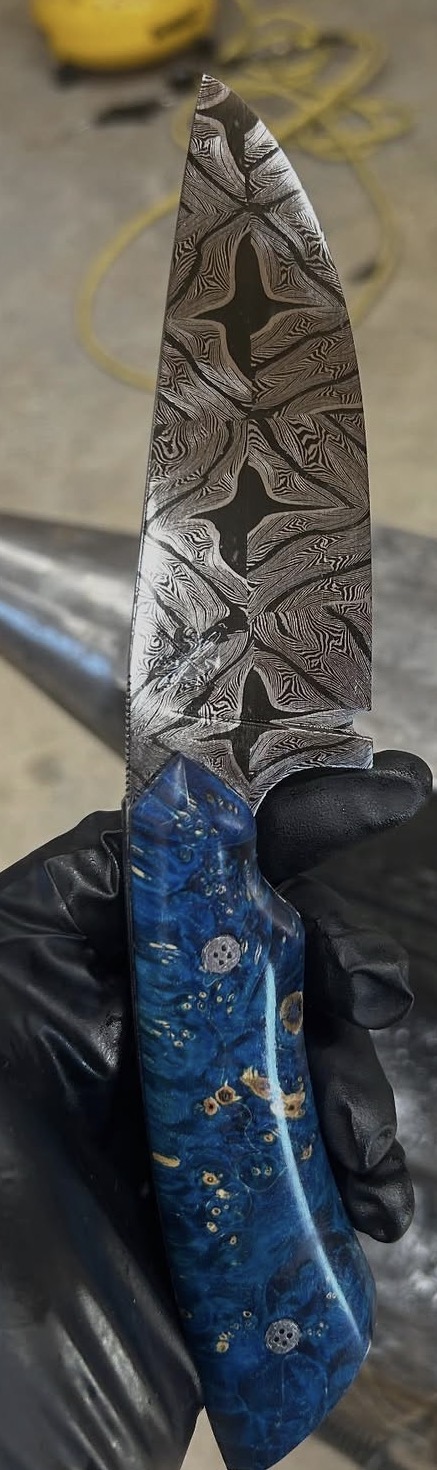 Patterned blade with blue resin handle
